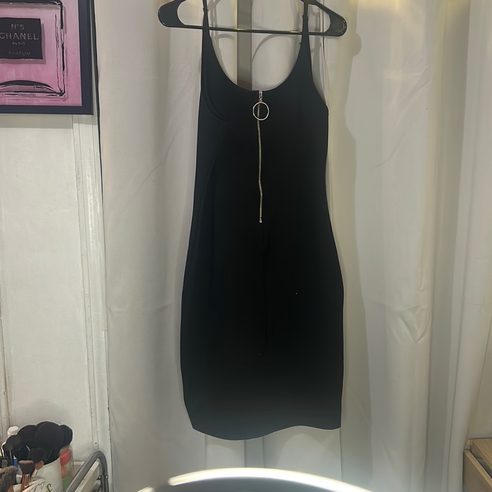 Black body shaped short dress.